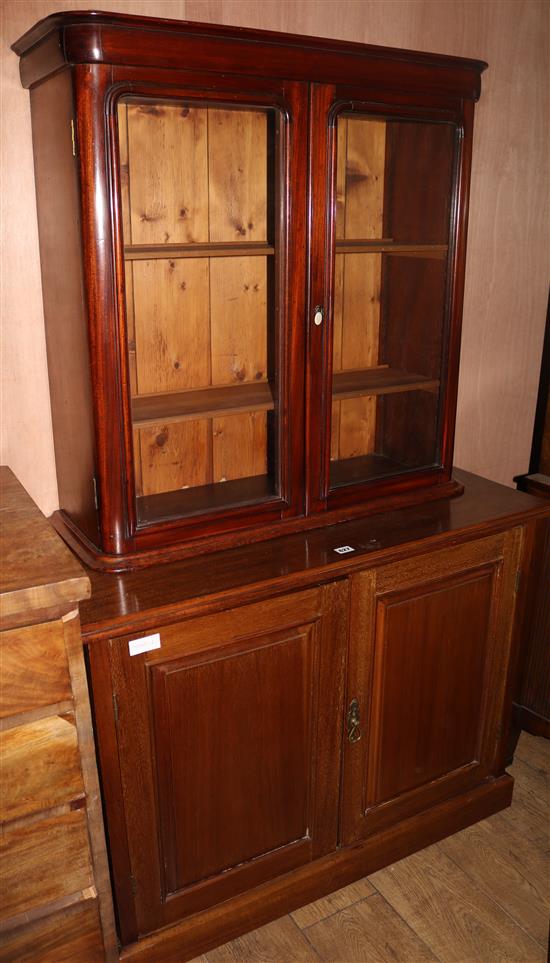 An Edwardian walnut filing cabinet, with later bookcase top